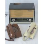 A c1960s Phillips type B3675U radio a/f, together with a c1980s BT OA3057 telephone in brown,