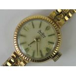 A 9ct gold ladies Bentima Star manual wind wristwatch with integral 9ct gold strap,