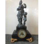 A Japy Frères polished slate mantel clock surmounted by a spelter figurine of woman and infant in