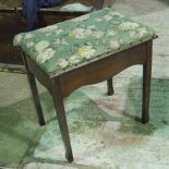 A single Edwardian mahogany piano stool lid lifting to reveal music compartment and stand within