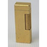 An Alfred Dunhill gold plated Rollagas cigarette lighter c1980, diamond cut geometric pattern.