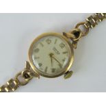 A 9ct gold ladies Vertex Revue manual wind wristwatch with 9ct gold strap,