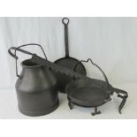 A quantity of metalware including a large cooking pot with loop handle, skillet, pan,