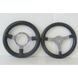 Two MotoLitre leather bound racing car steering wheels, each measuring 29cm dia.