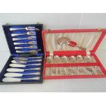 Two cased sets of flatware: one set of 6 fish knives and 6 fish forks and the other with a