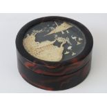 A delightful Japanese corkwood relief scenic picture within glazed lid of a circular jewellery box,