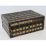 A 1920s porcupine quill trinket box with ivory dot inlays and lidded compartments to its interior,