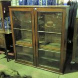 A large two-door glazed bookshelf C1930's 125 x 138cm.