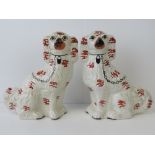 A pair of Staffordshire mantlepiece dogs