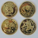 Four gold on silver Chinese Panda coins