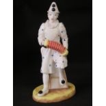 A coalport figure of a clown 'White Faced Seranade' from the Cavalcade of Clowns collection,