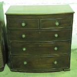 A bow fronted mahogany chest of two shor