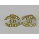 A pair of 9k gold earrings encrusted wit