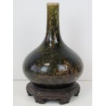 Chinese pottery; a mottled green and bro