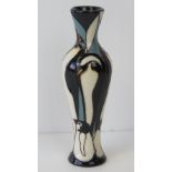 A Moorcroft slender vase decorated with penguins, signed by Kerry Goodwin, 20cm high.