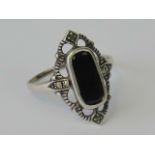 A silver, onyx and marcasite ring, stamp