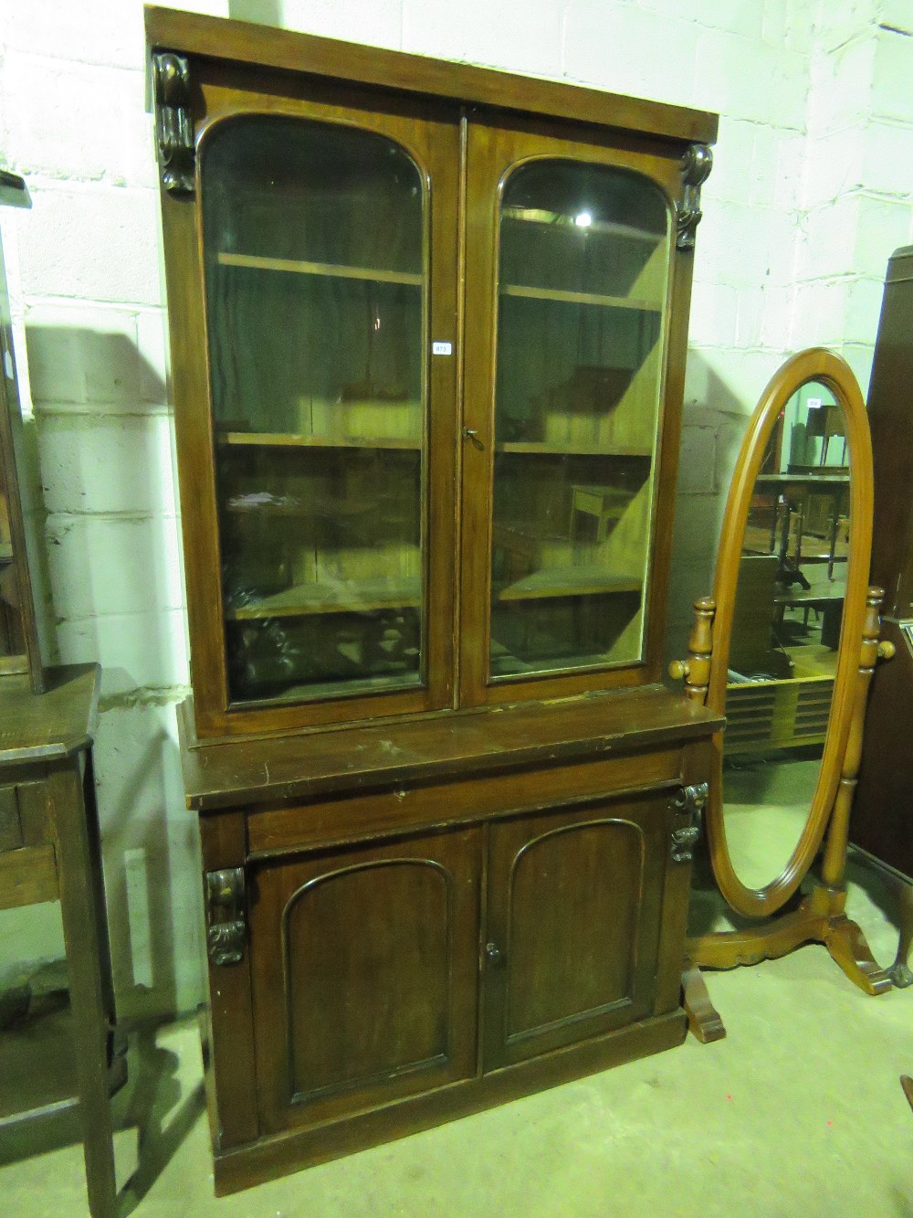 A Victorian glazed bookcase having two d