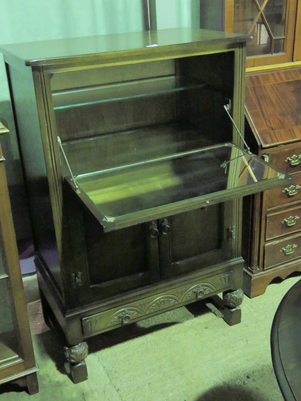 A old charm type drinks cabinet having f