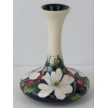 A Moorcroft long necked vase with Eglantine rose design by Rachel Bishop, 16cm high.