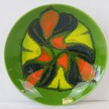 A Poole pottery Delphis green glazed dish c1970, 20cm dia.