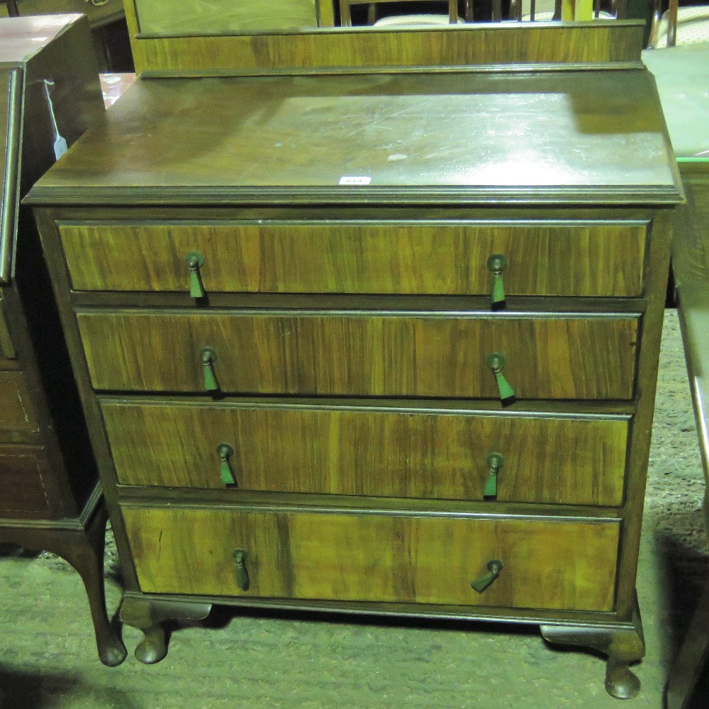 A chest of four graduating walnut drawer