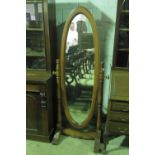 A contemporary oval cheval type mirror r