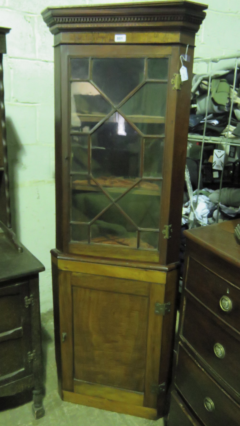 An Edwardian floor standing corner cabin