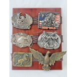 Six reproduction belt buckles including