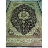 A blue ground Keshan carpet; 280cm x 200