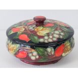 A Moorcroft powder bowl and cover with r