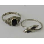 Two silver rings; one in the form of two