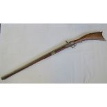 A 20th century copy of an 18th century flintlock rifle, gilt metal fittings, walnut stock,