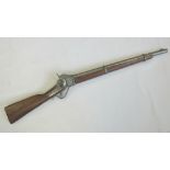 A 20th century copy of a flintlock rifle, white metal fittings, walnut stock, barrel 54cm in length.