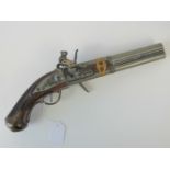 A 20th century copy of an 18th century double barrel flintlock pistol,