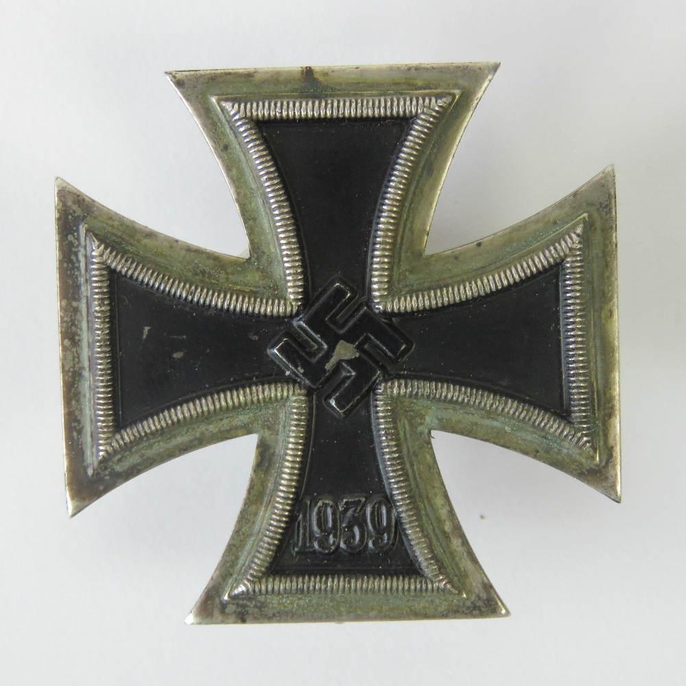 A WWII German Iron Cross 1st Class, pin stamped '20'.