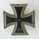 A WWII German Iron Cross 1st Class, pin stamped '20'.