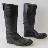 A pair of WWII German Officers army boots, complete with canvas pull strap and steel quarter heels.