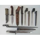 A selection of bayonet and knife attachments including; 2 WWII Spike bayonets, one Belgium,