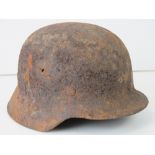 WWII German helmet, battlefield relic.