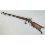 A 20th century copy of an 18th century flintlock rifle, black metal fittings, walnut stock,