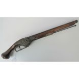 A 20th century copy of an 18th century wheel lock pistol, walnut stock, wheel lock a/f,