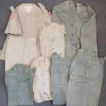 A quantity of lightweight khaki including; shirts, shorts, trousers, belts, epaulets.