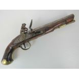 A late 18th century flintlock pistol marked tower with crown and GR under to the side action,