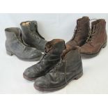 Three pairs of steel toe capped vintage military boots.