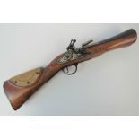 A 20th century copy of an 18th century blunderbuss flintlock pistol, walnut stock,