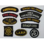 A quantity of cloth badges including; Head Fire Guard, Senior Fire Guard, L.A.R.P etc. Ten items.