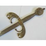 A sword with gilt metal pommel featuring a jousting knight motif,