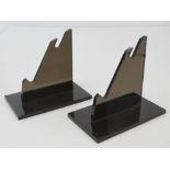 A pair of museum quality cotemporary plasticised stands for the display of a sword together with