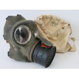 A canvas bag containing a standard issue full face gas mask.