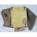 A WWII canvas map case containing a quantity of WWII maps within, and measuring 42 x 93cm open.